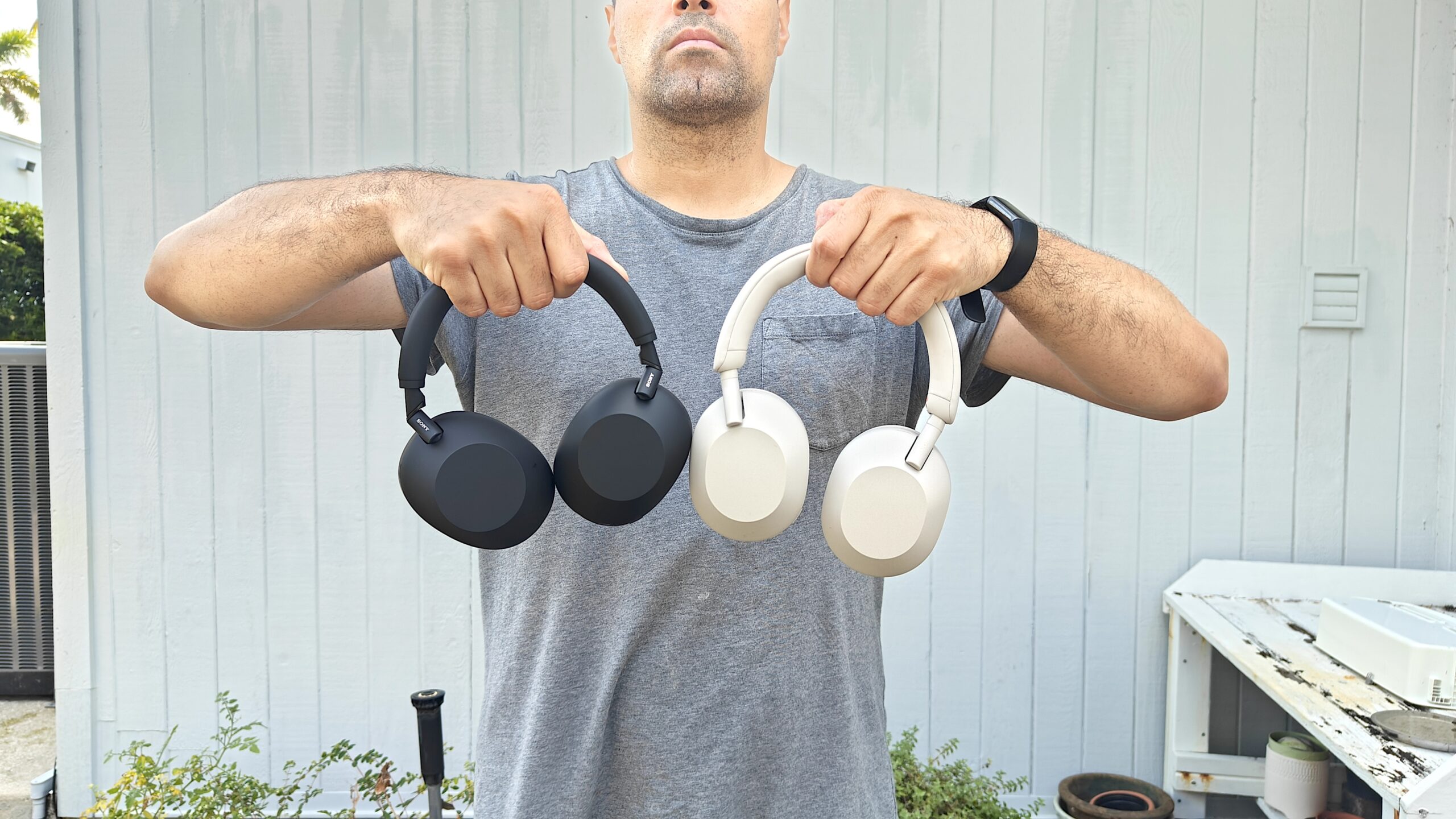 Our reviewer holding the Sony WH-1000xM6 vs Sony WH-1000xM5 in hand