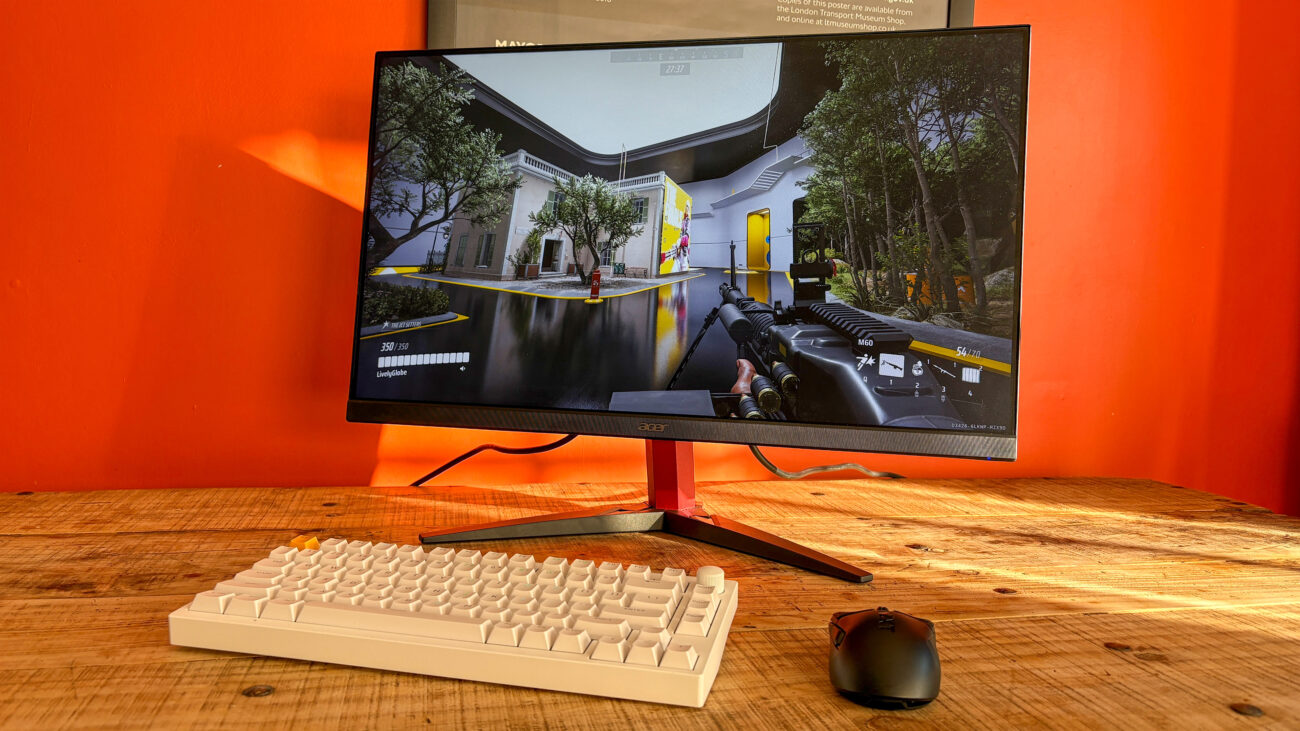 Acer Nitro KG272 E on table with keyboard and mouse in front with The Finals on display