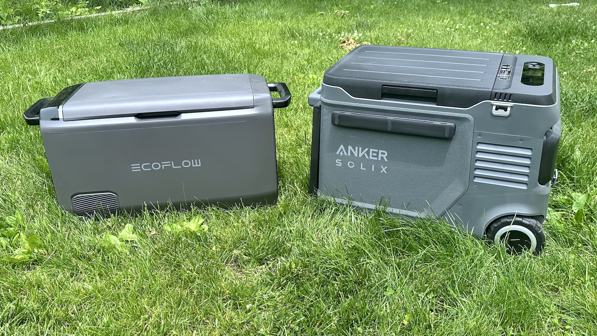 Anker Solix Everfrost 2 cooler next to EcoFlow Glacier cooler on grass