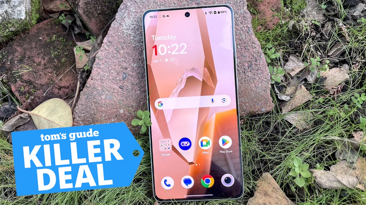 OnePlus 13R leaning against a rock with a Killer Deal tag