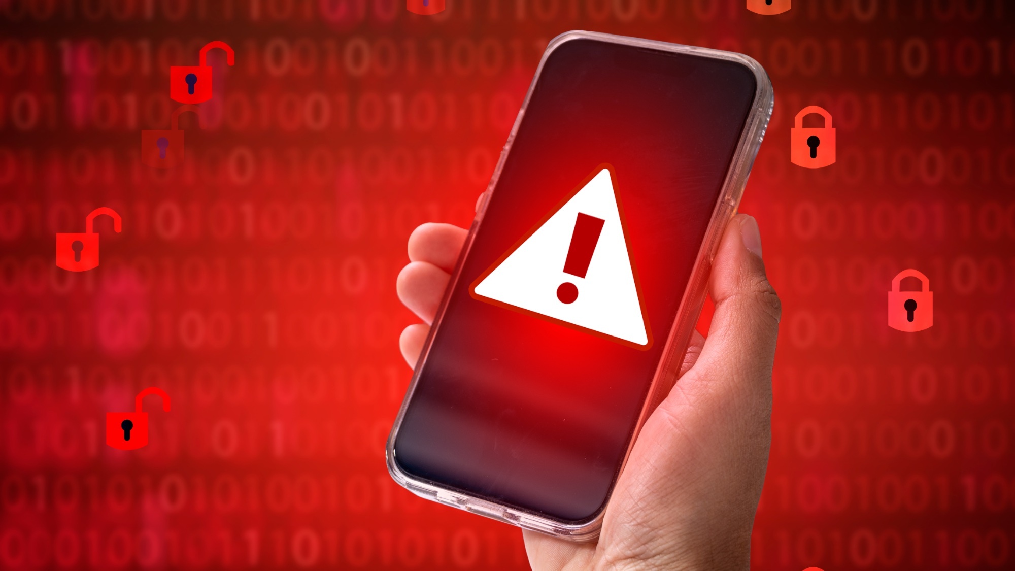 A phone with a warning sign on screen and locks and binary code in the background