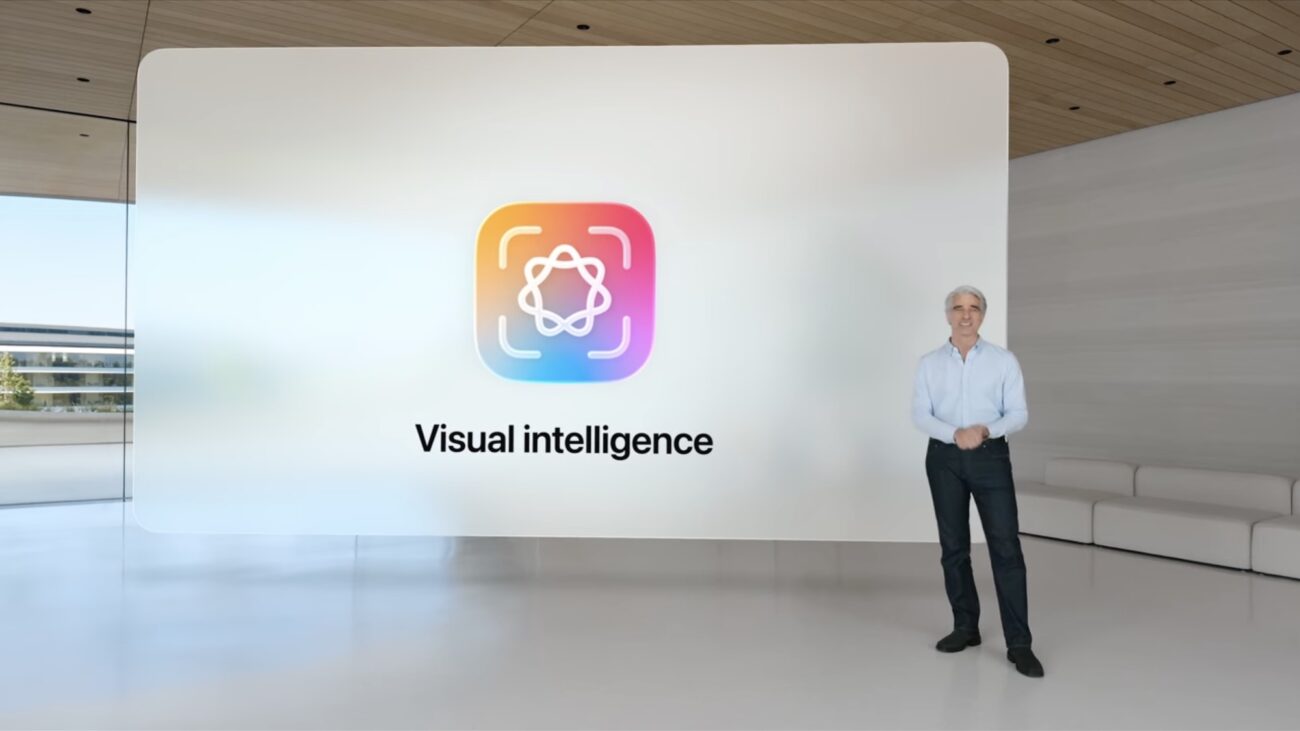 Craig Federighi standing in front of an Apple Visual Intelligence logo