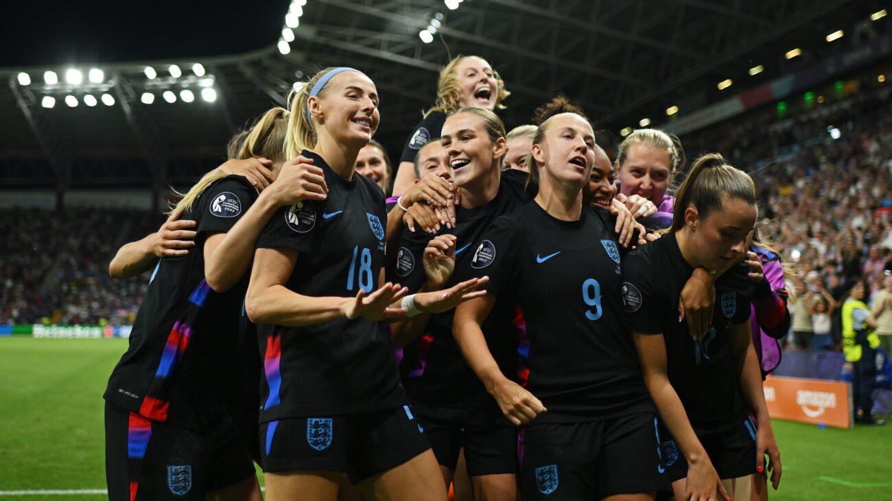 Chloe Kelly of England celebrates with her teammates after scoring her team's second goal from a rebound following a saved penalty in extra-time during the UEFA Women's EURO 2025 Semi-Final match between England and Italy at Stade de Geneve on July 22, 2025 in Geneva, Switzerland.