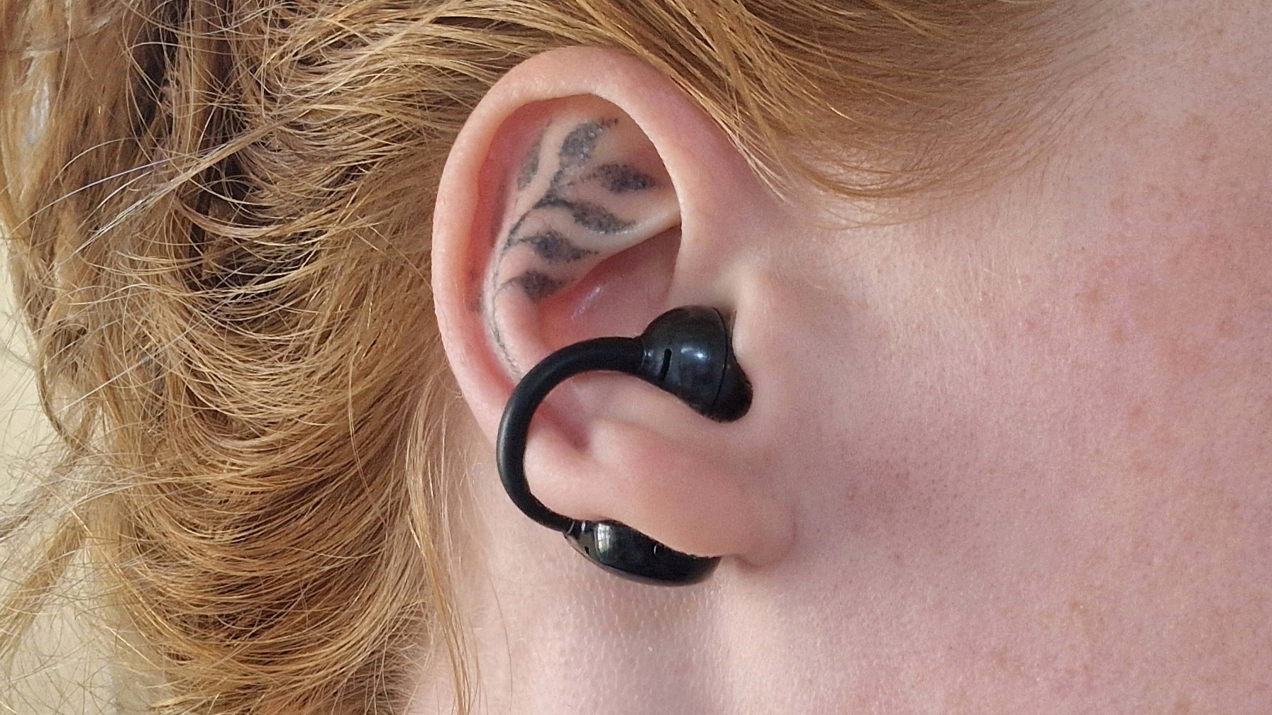 Close-up of SoundPeats Pop clip being worn in woman's ear