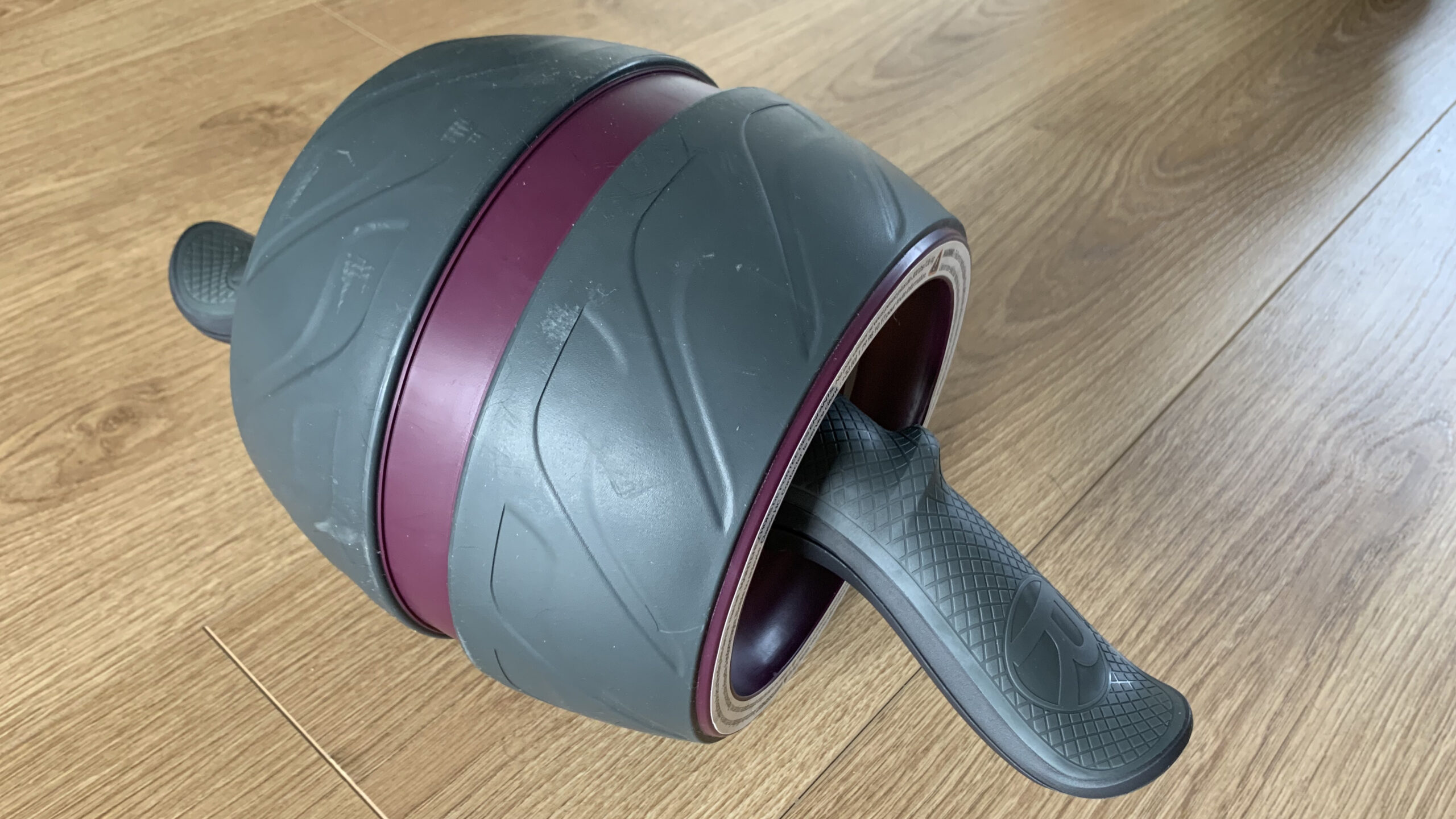 Perfect Fitness Ab Carver Pro being tested on wooden floor