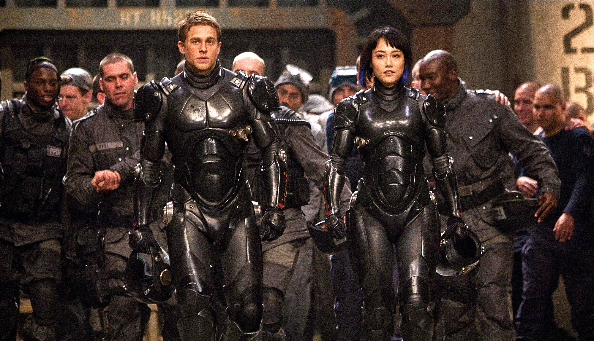 (From L to R) Charlie Hunnam as Raleigh Becket and Rinko Kikuchi as Mako Mori in Pacific Rim (2013), now on Netflix