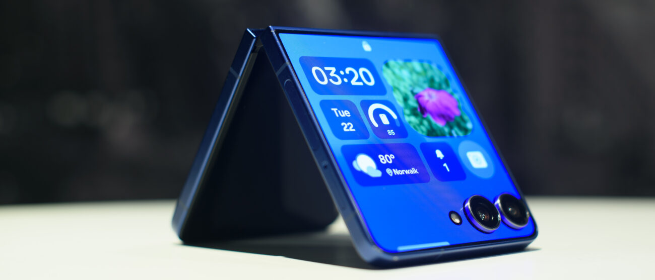 Samsung Galaxy Z Flip 7 in blue folded showing widgets on the cover display