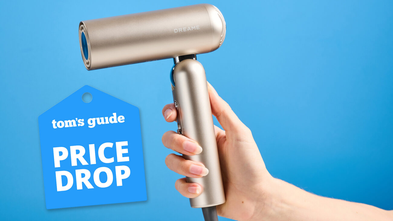 A woman's hand holding the Dreame Pocket Neo air styler in gold with a price drop tag.