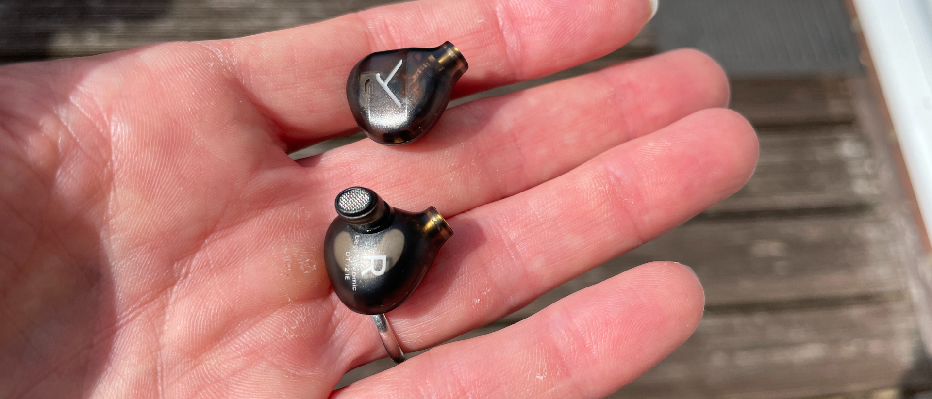 DT 72 IE in a hand, showcasing the small driver housings