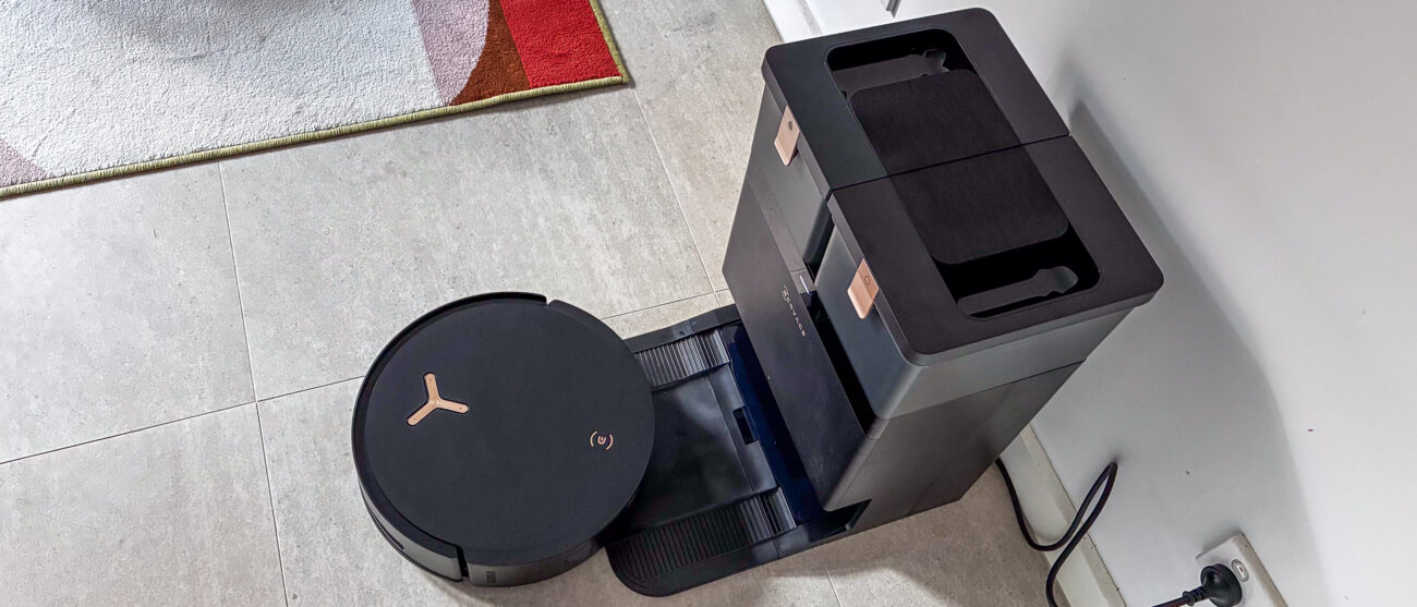 A top-down view of the Ecovacs Deebot X8 Pro Omni with the robot exiting the base station